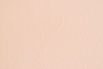 Fototapeta premium Light pink plastered wall background, plastered texture