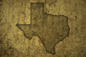 map of texas state on a old vintage crack paper background . - obrazy, fototapety, plakaty