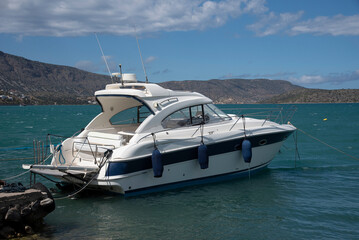 Fototapeta premium Elounda, Crete, Greece, EU. 2023. Motor yacht on the Mirabella Gulf at Elounda, Crete