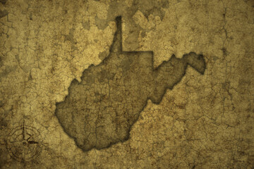 map of west virginia state on a old vintage crack paper background .