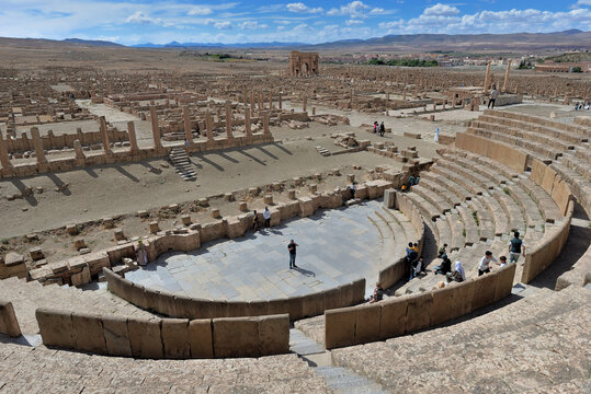 ANCIENT ROMAN THEATRE IN THE ARCHEOLOGICAL SITE OF TIMGAD IN ALGERIA