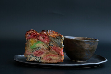 Close up a slice colorful mixed fruit cake