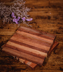 Brown wooden background with white flowers
