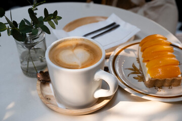 Afternoon hot coffee with mango cheesecake