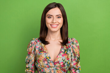 Obraz premium Photo of lovely positive girl beaming smile good mood wear floral dress isolated on green background
