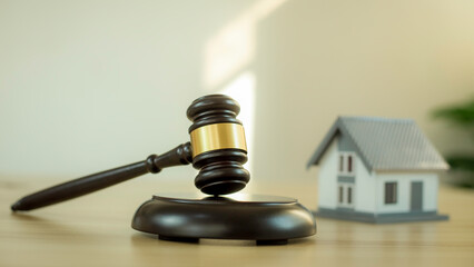 Fair hammer, hammer and wooden house The concept is used in real estate law agreements.