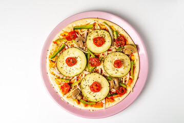 Vegetable pizza for vegetarians, with eggplant, pepper, cherry tomato, onion and mushroom, white background.