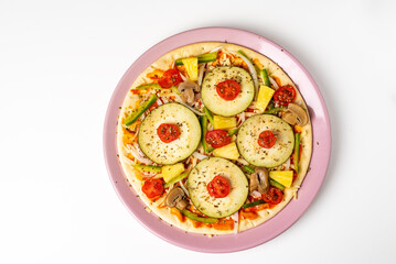 Vegetable pizza for vegetarians, with aubergine, pepper, cherry tomato, onion, mushroom and pineapple to give it sweetness, white background.