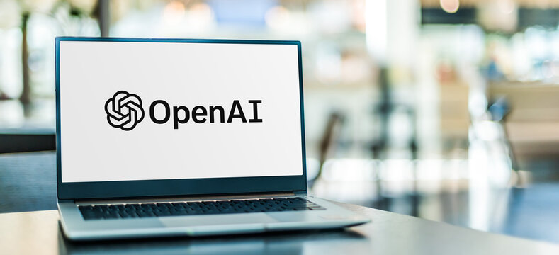 Laptop computer displaying logo of OpenAI