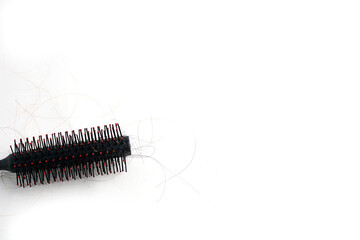 Hair loss and comb, hair loss every day, serious problems and hair loss on a white background.