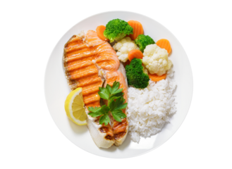 plate of grilled salmon steak, rice and vegetables isolated on transparent background, top view