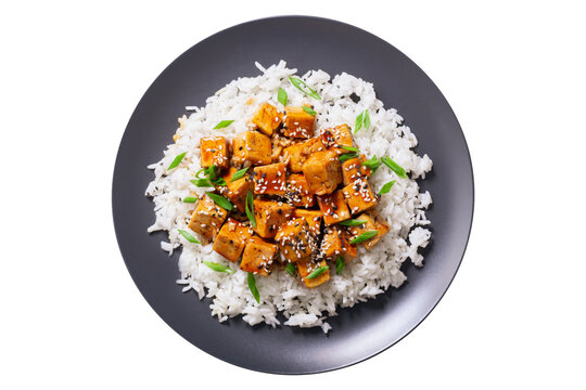 plate of rice and fried tofu with sesame seeds isolated on transparent background, top view