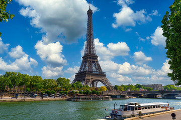 Fototapeta na wymiar View of Eiffel Tower and river Seine in Paris, France. Eiffel Tower is one of the most iconic landmarks of Paris