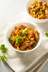 Stir-fried egg noodles with chicken breast. 