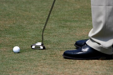 A golfer playing golf in the field.