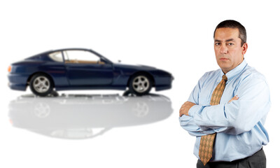Serious businessman who is in front of a car reflected in the bottom. Car blurred
