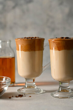 Dalgona coffee. Iced whipped coffee and milk. Refreshing coffee drink in glass cups.
