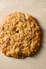 Close up, one oat cookies with peanut butter and chocolate chips in a plate. Top view