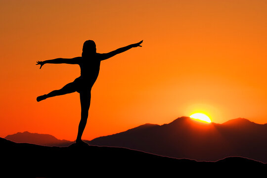 Young woman relaxing with early morning Yoga