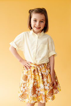 Girl showing off her clothes in a studio portrait