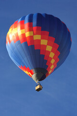 A vibrant hot air balloon high in the sky.