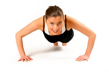 Fototapeta na wymiar young woman is working out over white background