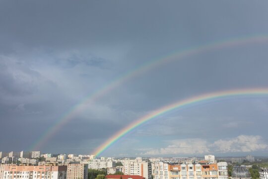 double rainbow in the sunny sky