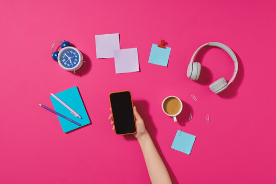 Creative flat lay photo of workspace desk with smartphone