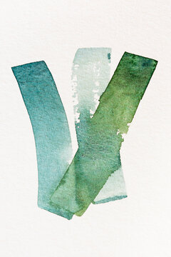 Green watercolor paint strokes on white background
