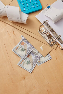 Close up of documents with receipts, money.
