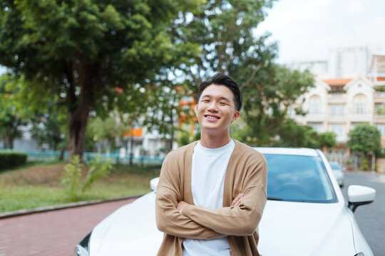 Handsome man on the background of car