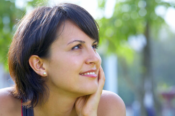 Portrait of young beautiful woman  in summer environment