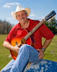 Handsome mature singing cowboy on the farm.