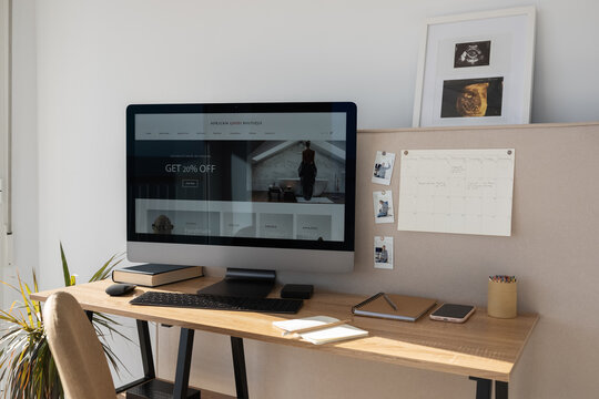 Contemporary workplace with pin board and computer