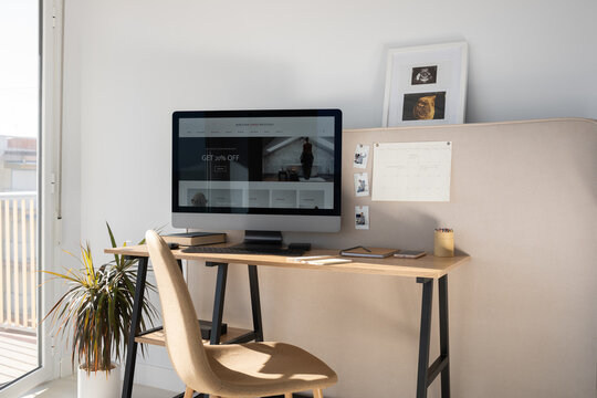 Creative workplace with desktop and pin board