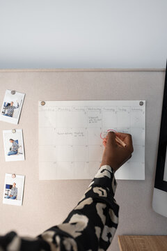 Businesswoman planning agenda schedule on calendar
