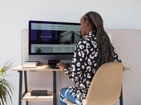 Female freelancer surfing internet during remote work