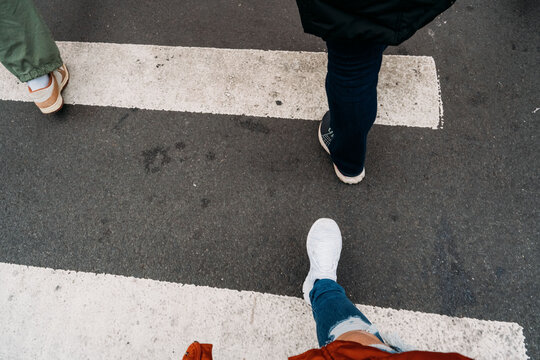 People crossing a crosswalk in New York City. 