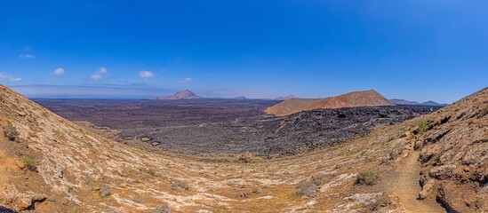 Fototapeta na wymiar Panoramic view over the barren volcanic Timanfaya National Park on Lanzarote