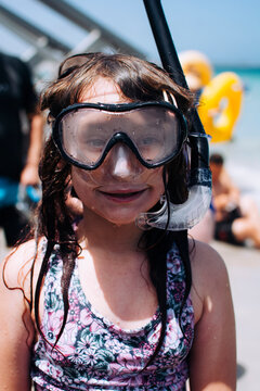 Young girl with snorkelling gear on