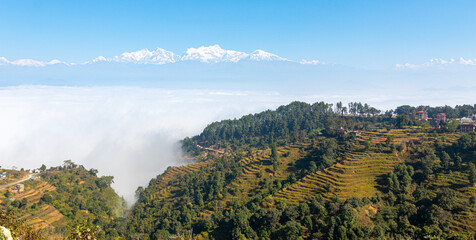 Himalaya seen from near bandipur with fields in foreground