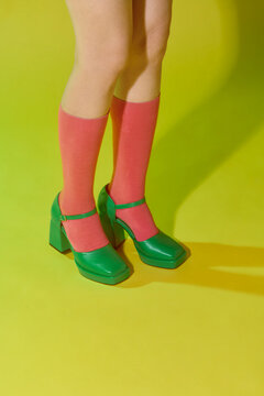 Woman wearing bright socks with sandals and space for design