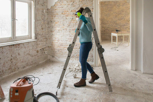 A woman is renovating her home