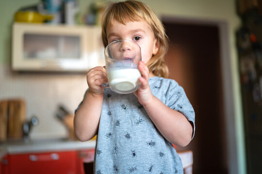 child drinking milk on breakfast