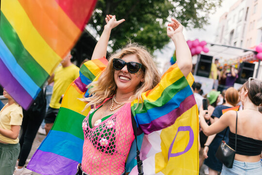 Energetic Woman in Pink Mesh Suit and Daisy Bikini at Pride