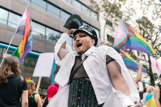 Man in Glam Make-up and Shiny Officer Hat at Pride