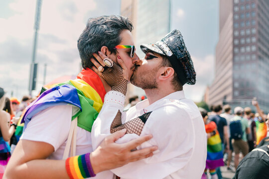 Gay couple sharing a kiss at Pride
