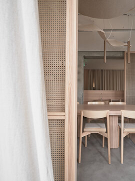Minimalist restaurant interior with wooden furniture