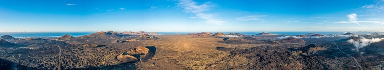 Fototapeta na wymiar Panoramic drone picture over the barren volcanic Timanfaya National Park on Lanzarote