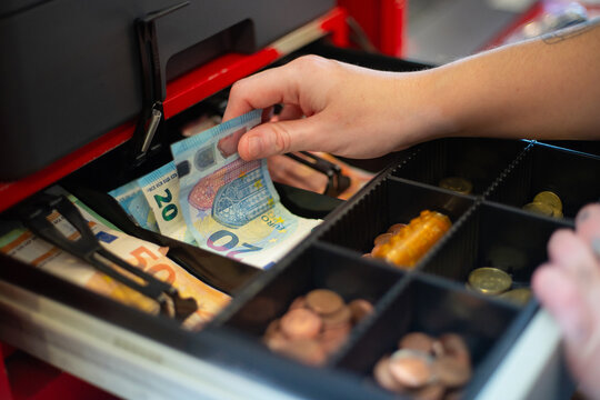Woman selecting bills